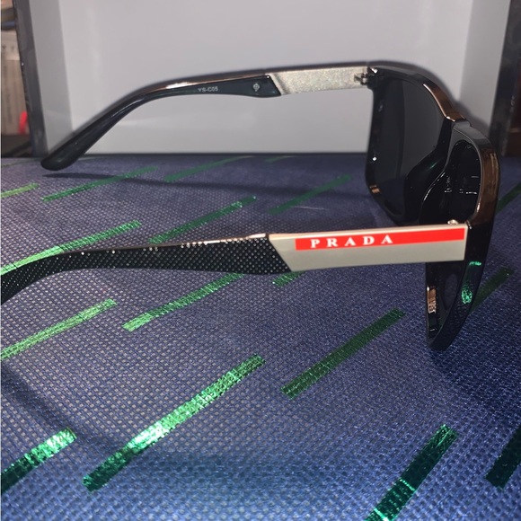 Prada unisex sunglasses, looks brand new. Sleek black with signature red stripe. - Picture 3 of 5